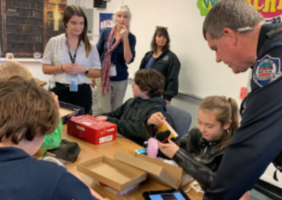 Officers Deliver Shoeboxes
